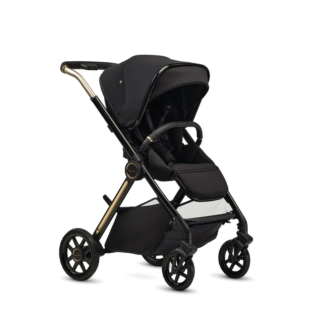 Espresso brown baby stroller with gold accents, adjustable canopy, and four wheels