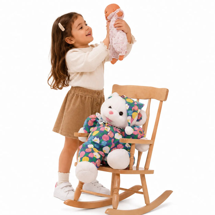 Solid wooden grand-ma classic kids rocking chair - little girl playing with her toys, and a teddy bear is sitting in the chair