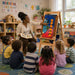 Solid maple wood large book easel at daycare during story time with children listening