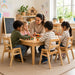 Solid maple wood stackable children daycare classroom chair - Daycare lifestyle - Children around a table playing