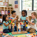 Solid maple wood puppet rack - children playing with puppets in a daycare room