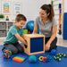 Solid maple kids sensory discovery box - kid playing with the therapist to guess what object is in the box