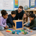 Solid maple kids sensory discovery box - kids in a classroom with teacher at school playing with the box guessing