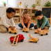 Solid maple wood transport vehicle toys - childrend playing with the various maple wood trucks and airplane at daycare