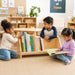 Solid maple wood table-top book shelf at daycare - on the floor with kids kneeling to read