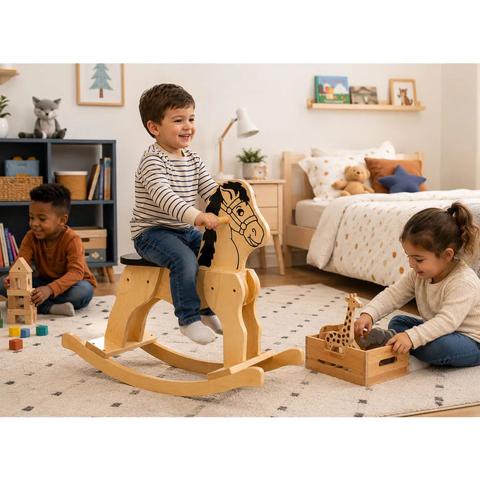 Solid durable maple wood classic rocking horse toy lifestyle in a kid bedroom with a boy on the horse and other children playing around - Goldtex