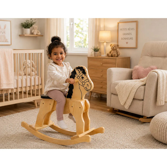 Solid durable maple wood classic rocking horse toy in a nursery or toddler room with a little girl proudly sitting on the horse - Godltex