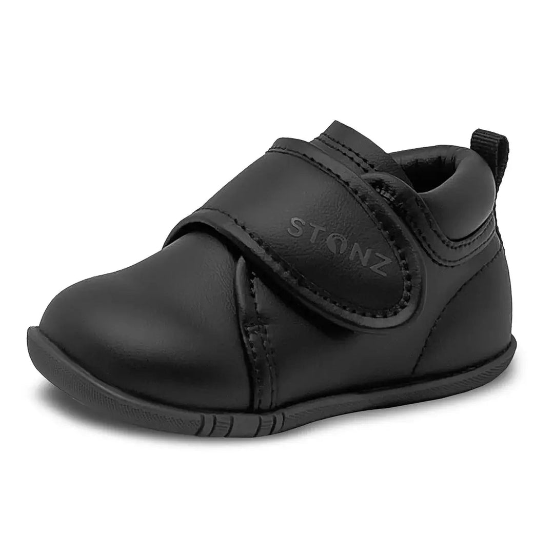 Stonz Everyday Cruiser black baby shoe with velcro strap shown on a plain white background.