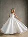 Teter Warm Addison Satin Bow Shoulder Communion Dress worn by a girl standing indoors.