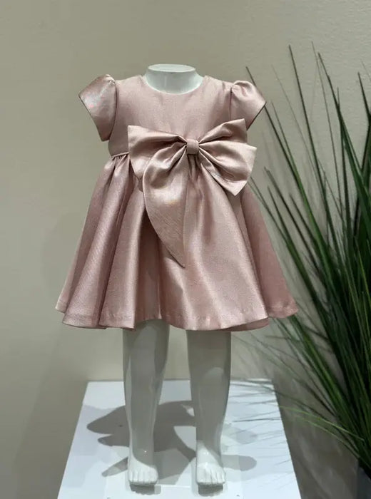 Teter Warm Ailani pink metallic party dress with large bow displayed on a child mannequin