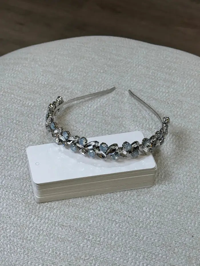 Teter Warm aquamarine blue and silver headpiece displayed on a light textured surface.
