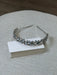 Teter Warm aquamarine blue and silver headpiece displayed on a light textured surface.