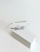 Teter Warm Beatrix Silver Headband with crystal bow detail displayed on white box.