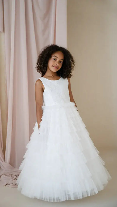Teter Warm Celeste Off-White Communion Dress worn by a girl, shown standing in a studio setting.
