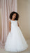 Teter Warm Celeste Off-White Communion Dress worn by a girl, shown standing in a studio setting.