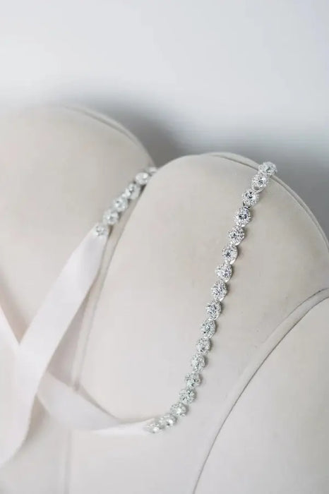Teter Warm Cora Off-White Communion Dress with jeweled straps shown in close-up detail.