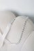 Teter Warm Cora Off-White Communion Dress with jeweled straps shown in close-up detail.