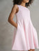 Teter Warm Diva bright pink party dress worn by a child, shown in a studio setting.