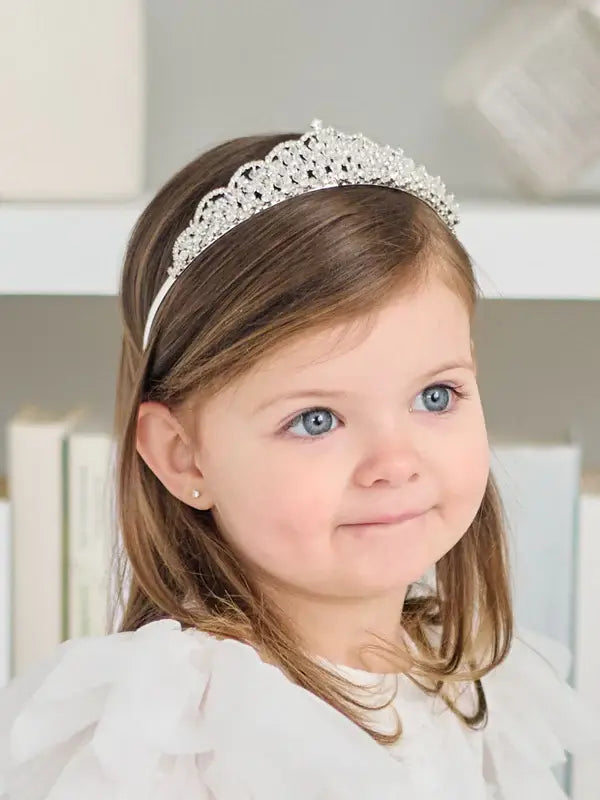 Teter Warm Eloise Rhinestone Tiara worn by a young girl with light brown hair indoors.