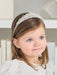 Teter Warm Eloise Rhinestone Tiara worn by a young girl with light brown hair indoors.