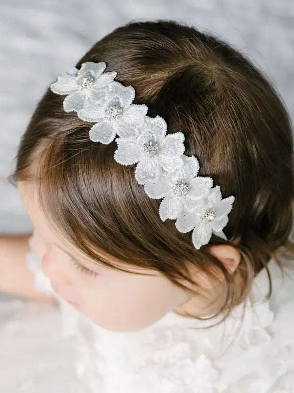Teter Warm Floral Headband with Crystal shown on a young child with dark hair and white dress.