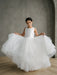 Teter Warm Girls Off-White Pearl Communion Dress displayed on a young girl standing indoors.