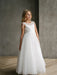 Hailey Lace Sequin Communion Dress shown on a young girl standing indoors against a grey wall.