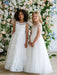 Teter Warm Hailey Lace Sequin Communion Dress on two girls standing in front of floral backdrop.
