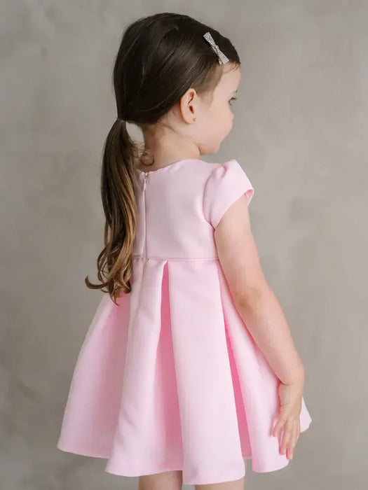 Teter Warm Lettie Pink Party Dress worn by a young girl standing against a neutral background.
