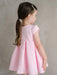 Teter Warm Lettie Pink Party Dress worn by a young girl standing against a neutral background.