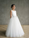Liza Satin Communion Dress shown on a young girl standing indoors against a neutral background.