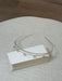 Teter Warm Mika pearl rhinestone double headband displayed on a stack of white cards on a beige surface.