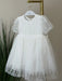 Teter Warm Perla Off-White Sequin Baptism Dress displayed on a hanger against a neutral background.