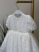 Teter Warm Precious Lace Baptism Dress displayed on a hanger, featuring delicate white lace detail.
