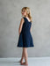 Teter Warm Rees dark sleeveless party dress shown on a young girl standing barefoot indoors.
