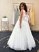 Teter Warm Shelly Satin Bow Communion Dress on a girl standing in a boutique with pastel dresses in the background.