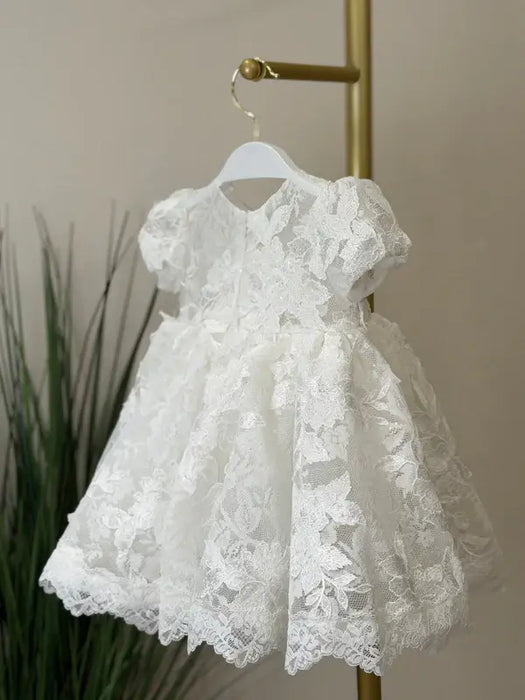 Teter Warm Sia Off-White Floral Baptism Dress displayed on a hanger with lace details.