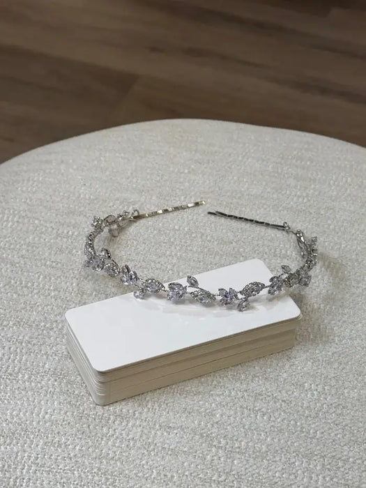 Teter Warm Trixie Blue & Silver Headpiece with crystal accents displayed on a textured surface.