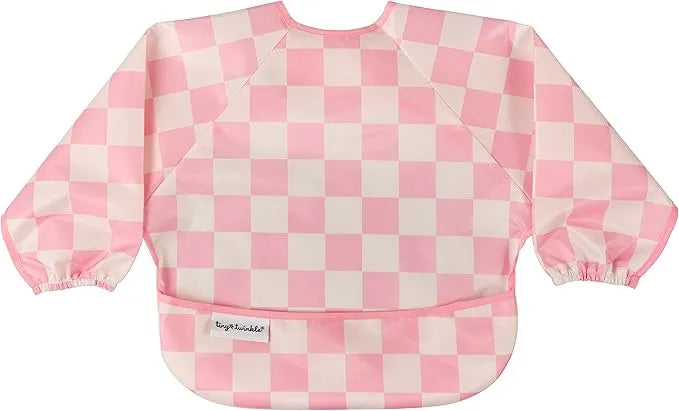 Tiny Twinkle Water Mess Proof Bib with sleeves in pink and white checkered pattern, laid flat.