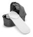 Uppababy bassinet cover in white displayed on a grey bassinet against a plain background.
