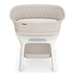 Modern beige baby bassinet with mesh sides and white storage shelf