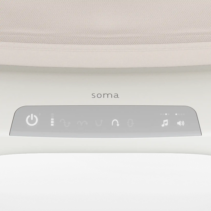 Close-up of electronic bassinet control panel with power, music, and sound settings