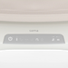 Close-up of electronic bassinet control panel with power, music, and sound settings