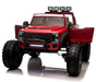 Voltz Toys F-450 lifted ride-on car in red with open doors and large off-road tires, shown front view.