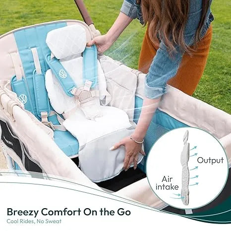 Wonderfold cooling seat cushion installed in a stroller, with a person adjusting it outdoors.