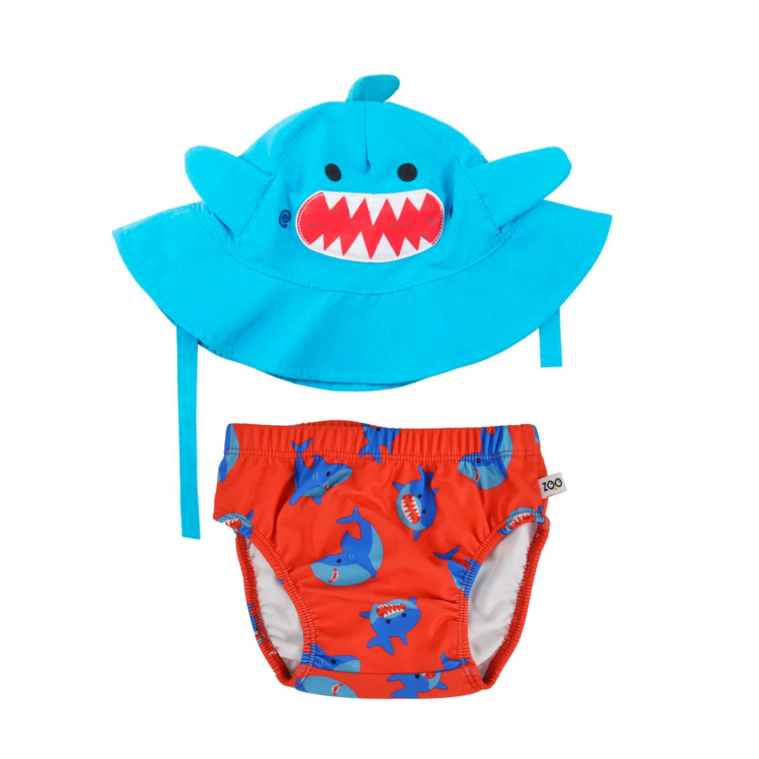 Zoocchini swim diaper set featuring a blue shark-themed hat and red swim diaper with shark print on white background.